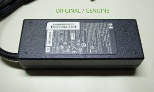 Original HP 90W power adapter close up